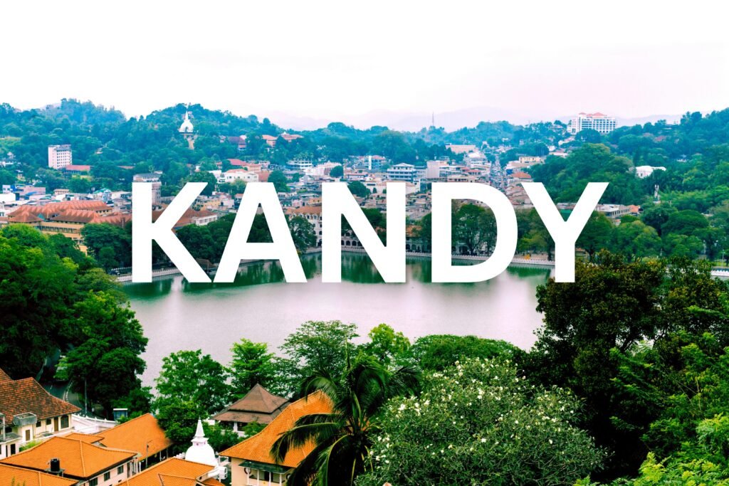 Scenic view of Kandy Lake surrounded by trees and city buildings in Kandy, Sri Lanka