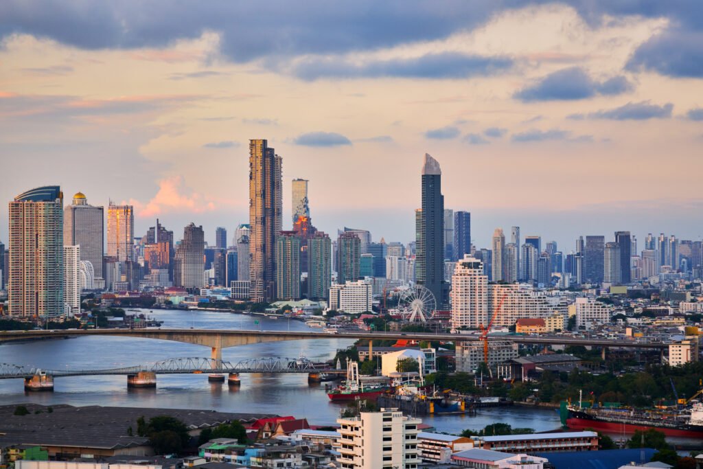 scenic of evening twilight skyline Bangkok cityscape with double bridge and chao praya river