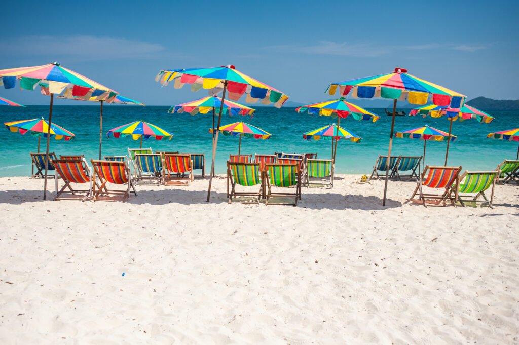 Beach chair under the umbrella of colorful on the beach Phuket, Thailand